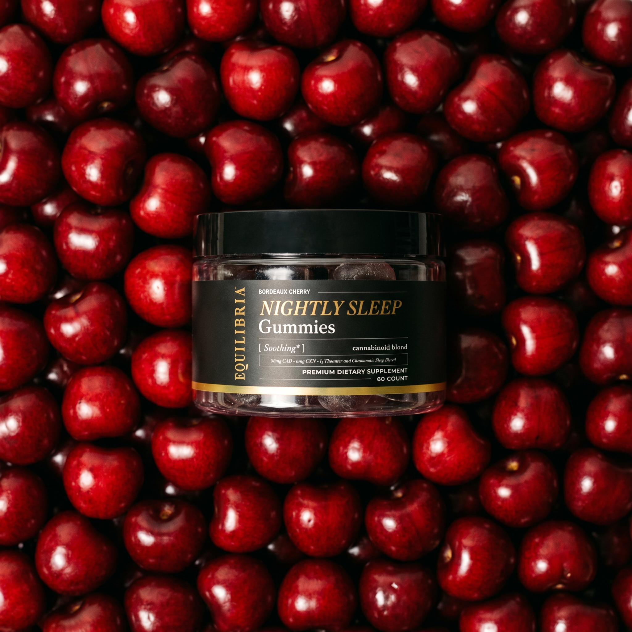 Jar of Night Gummies with CBD on a background of cherries