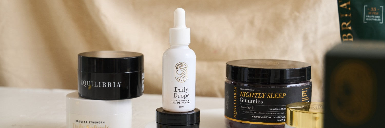 Equilibria Daily Drops CBD oil tincture and gummies side by side — comparing sublingual drops and chewable CBD formats for daily wellness