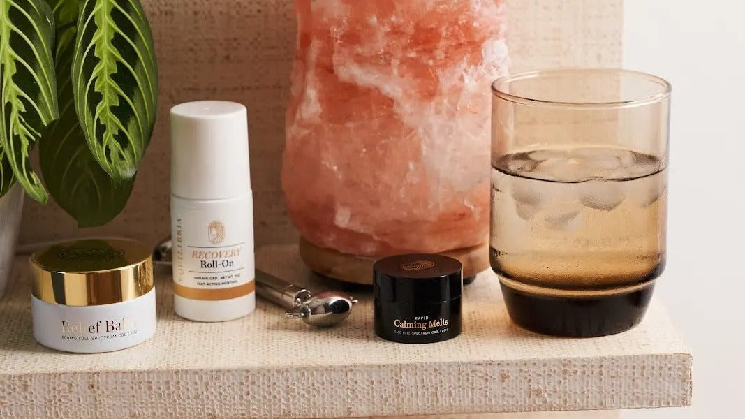 Equilibria women holding CBD wellness products — morning, afternoon, and night routine