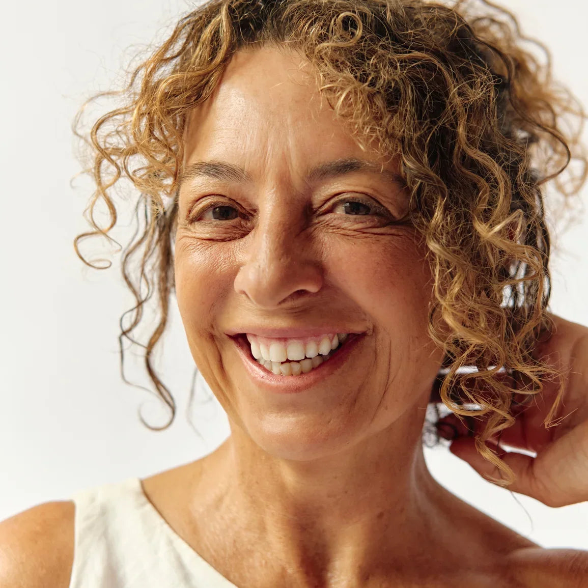 Smiling woman with curly hair