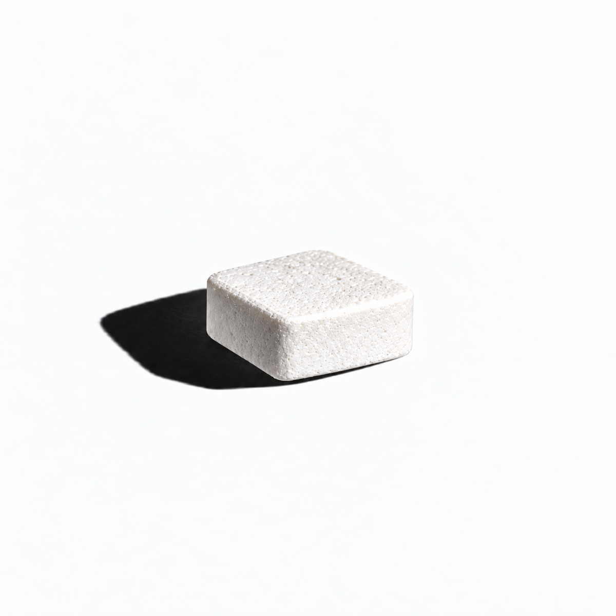 Single dissolving troche in dramatic lighting