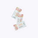 Three 'Tipsy' drink THC + CBD hemp packets on a white background
