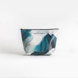 A small blue pouch with a white and blue pattern, displayed against a neutral background.