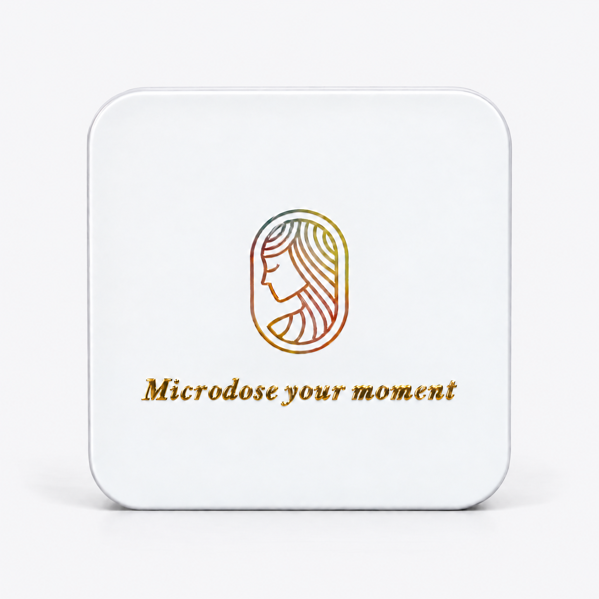 White square metal tin that reads "microdose your moment" on the front with a goddess logo in rainbow
