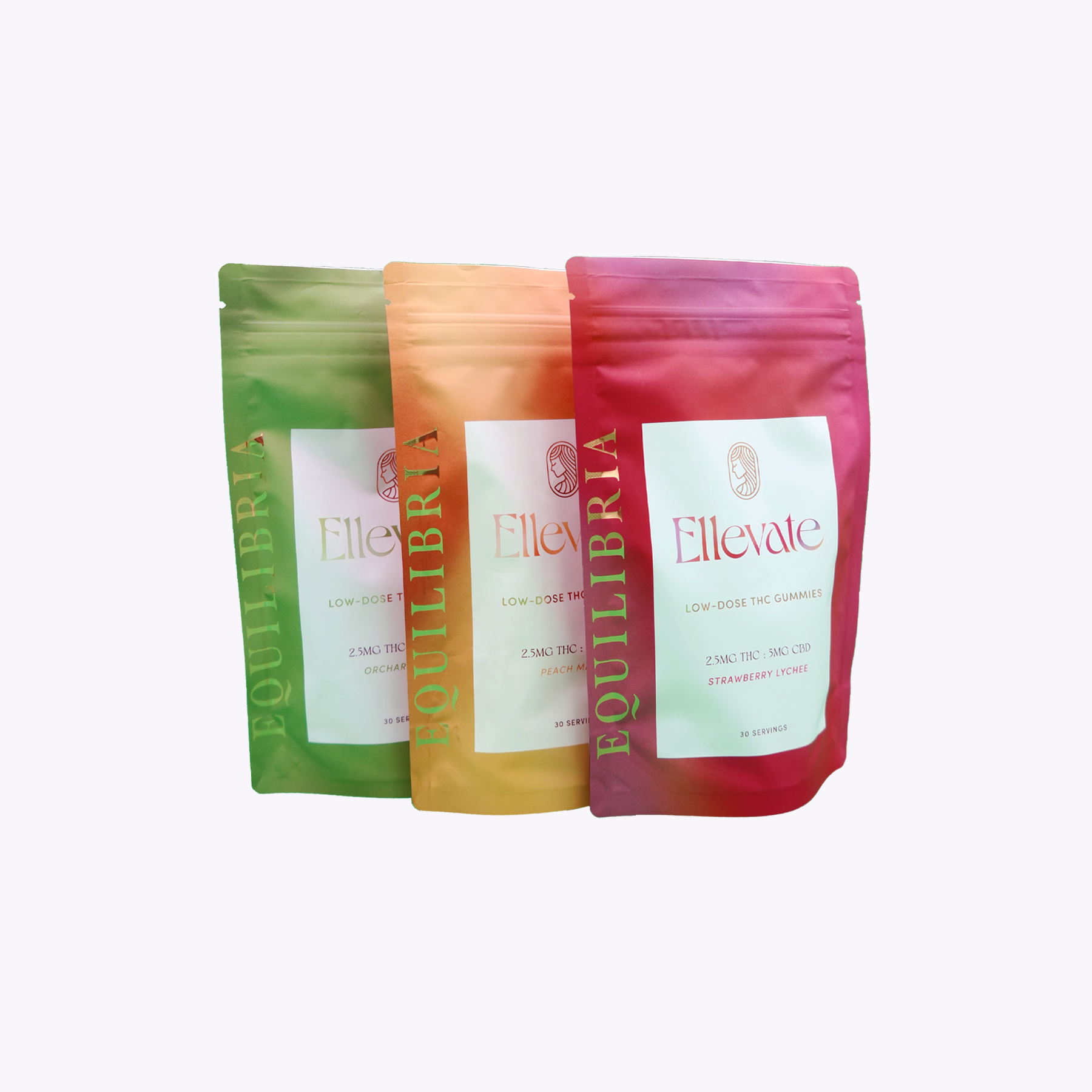 Three colorful packages of Equilibria Low-Dose THC and CBD Hemp Gummies on a white background