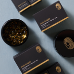 Product Display of Extra Strength Softgels in Black Jar and Black packaging on light blue background