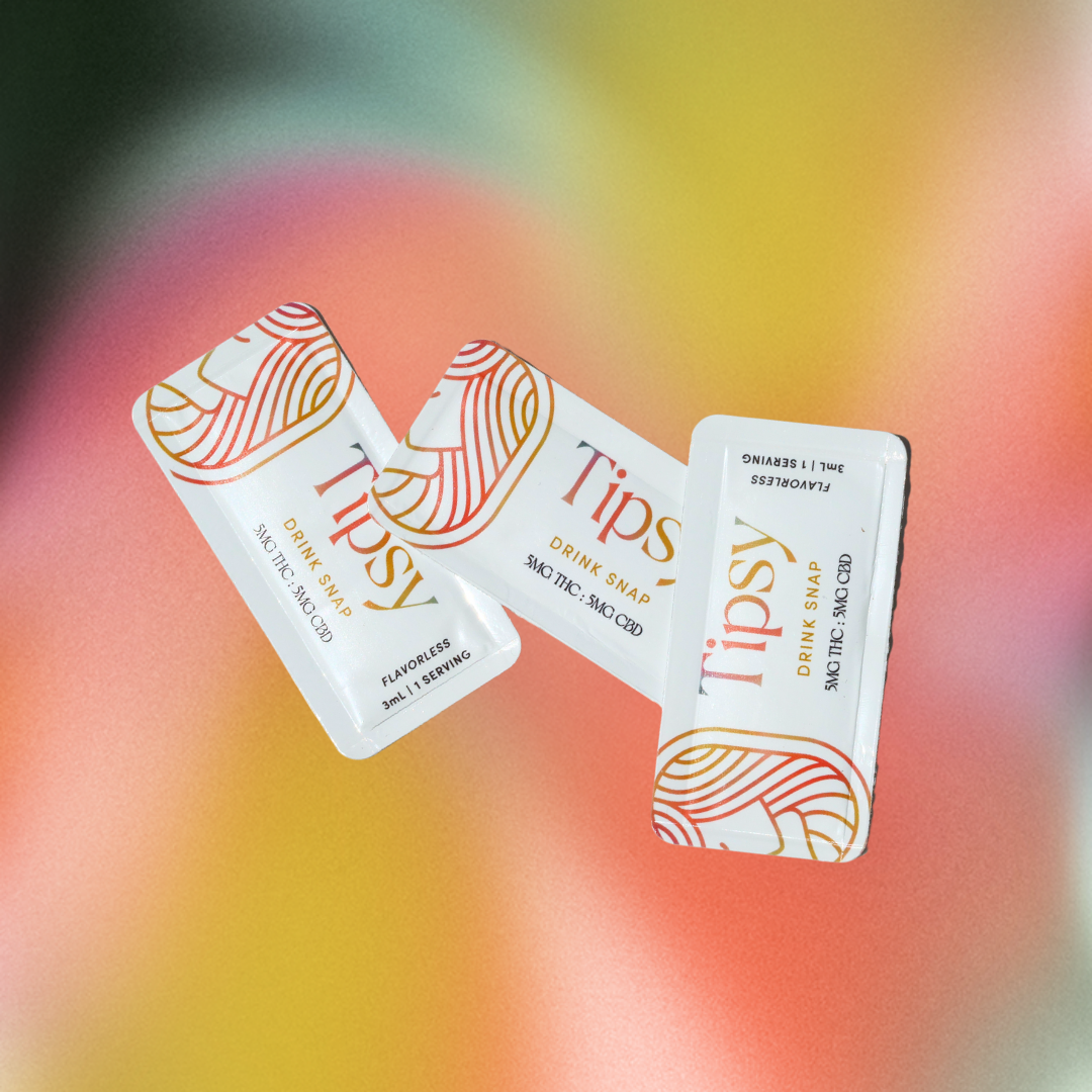 Three 'Tipsy' drink snaps on a colorful blurred background